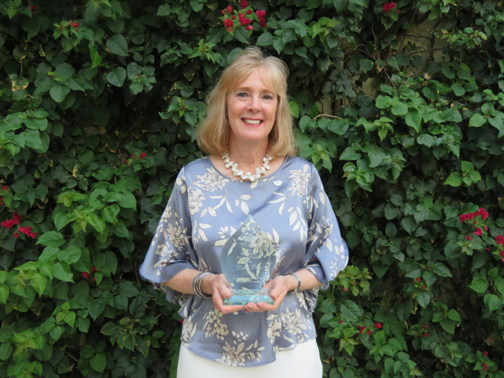 Debby Parr with The Crystal Castor Award for Outstanding Volunteer Service