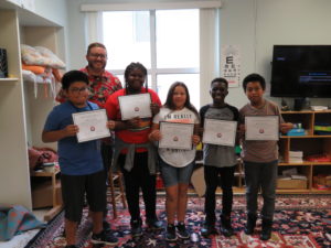 Project Grow students holding certificates