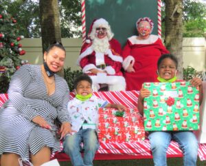 Client and kids posing with Santa and Mrs. Clause at Santa Shoppe